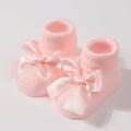 Chaussettes pour bébé en tricot avec nœud